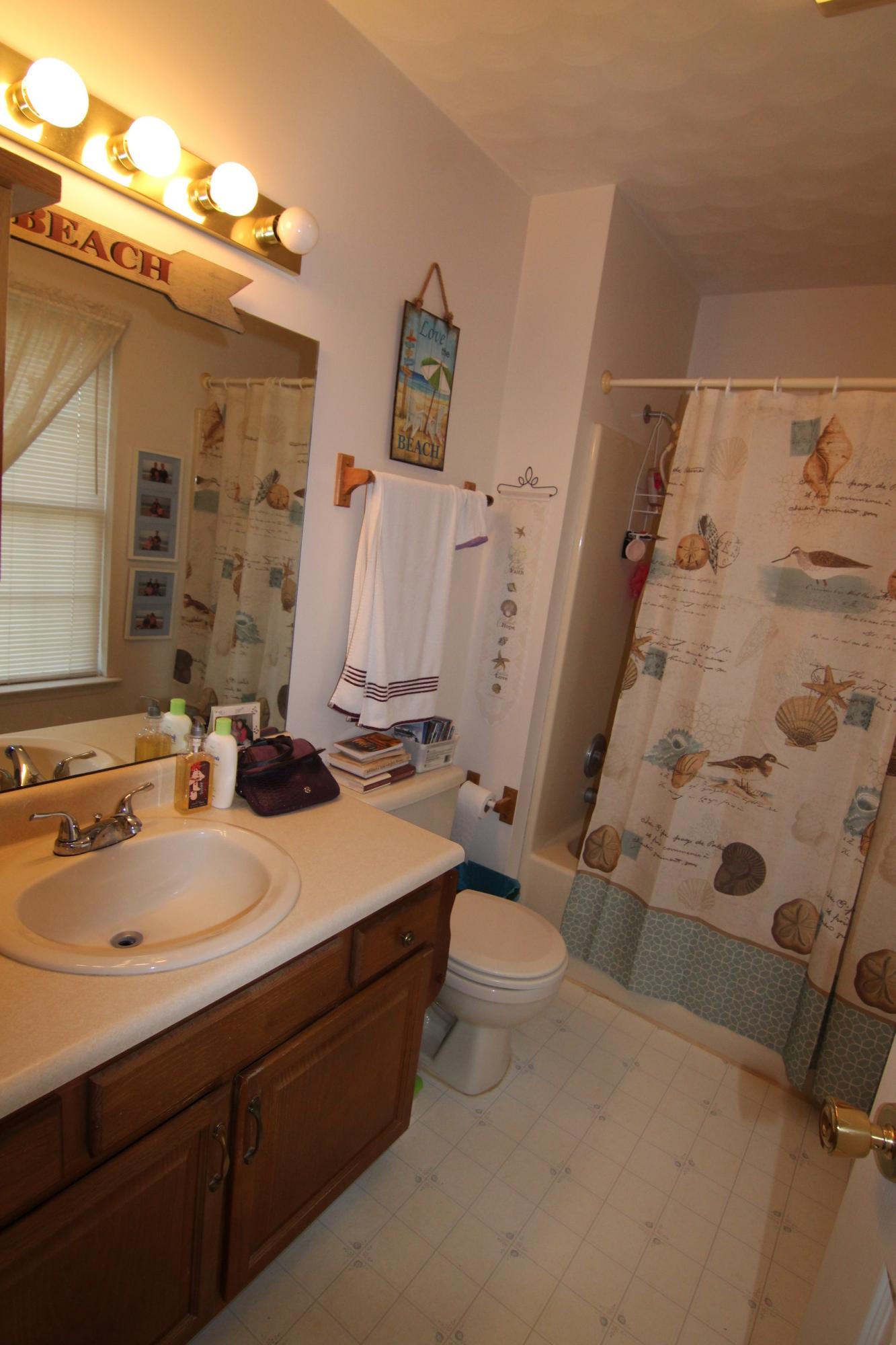 6878 Goodview Road Goodview, VA 24095 - Photo 8 of 15 a bathroom with a sink toilet and shower