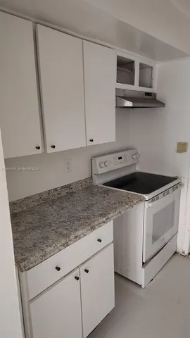 a white refrigerator freezer and a washer