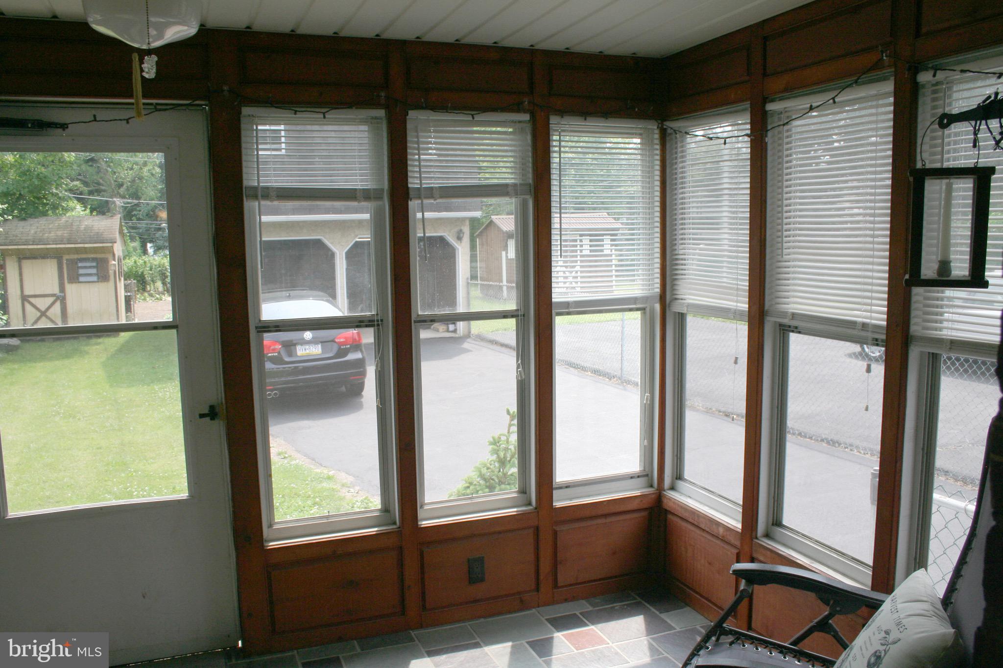 234 East County Line Road Hatboro, PA 19040 - Photo 6 of 29 enclosed porch with view of backyard