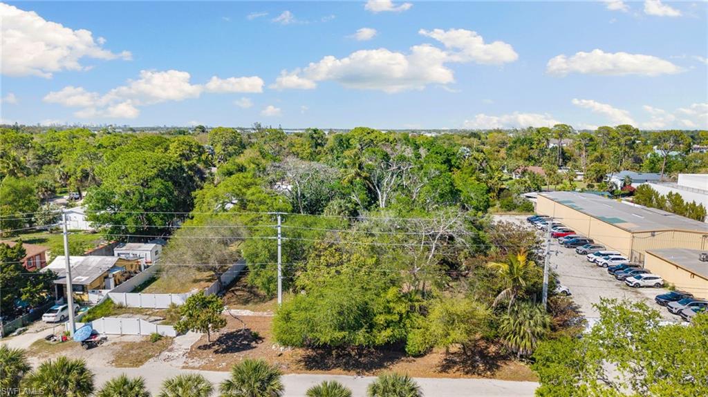2995 Terrace Avenue Naples, FL 34104 - Photo 7 of 7 a view of a lake with a houses