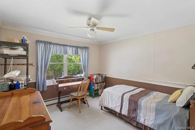 a bed room with a bed and a chair