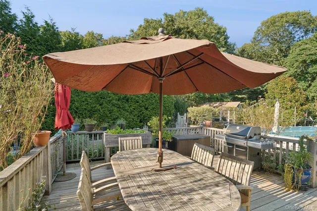 an outdoor space with furniture and umbrella