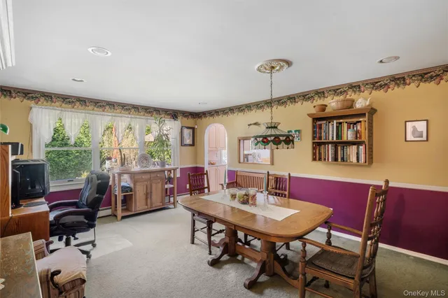 a view of a dining room with furniture window and outside view