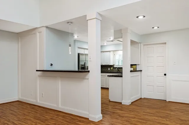 a view of kitchen with wooden floor