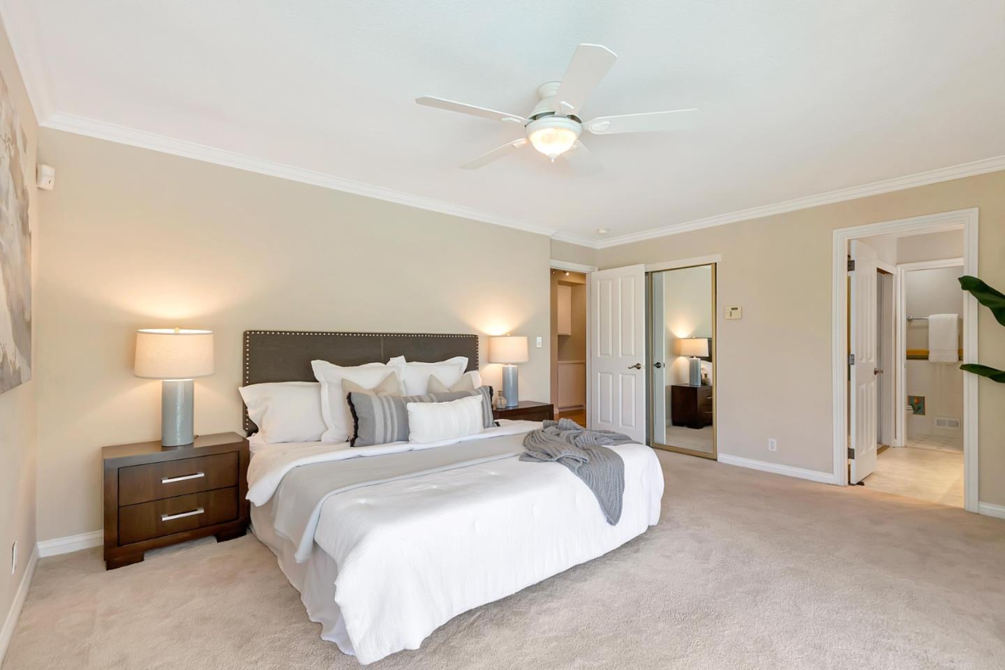 Utopia Place San Jose, CA 95127 - Photo 14 of 35 a spacious bedroom with a bed and a lamp