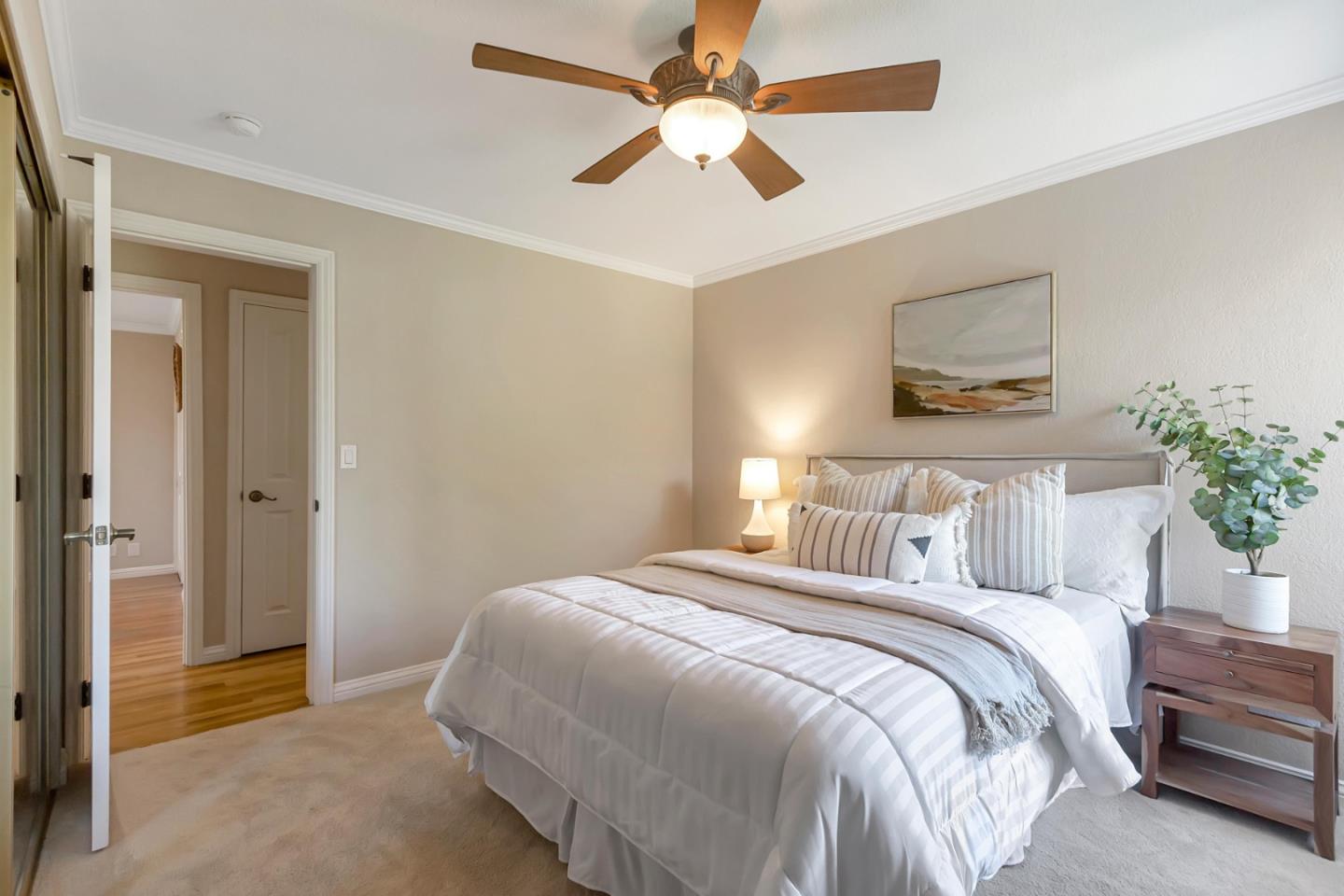 Utopia Place San Jose, CA 95127 - Photo 15 of 35 a bedroom with a bed and a chandelier