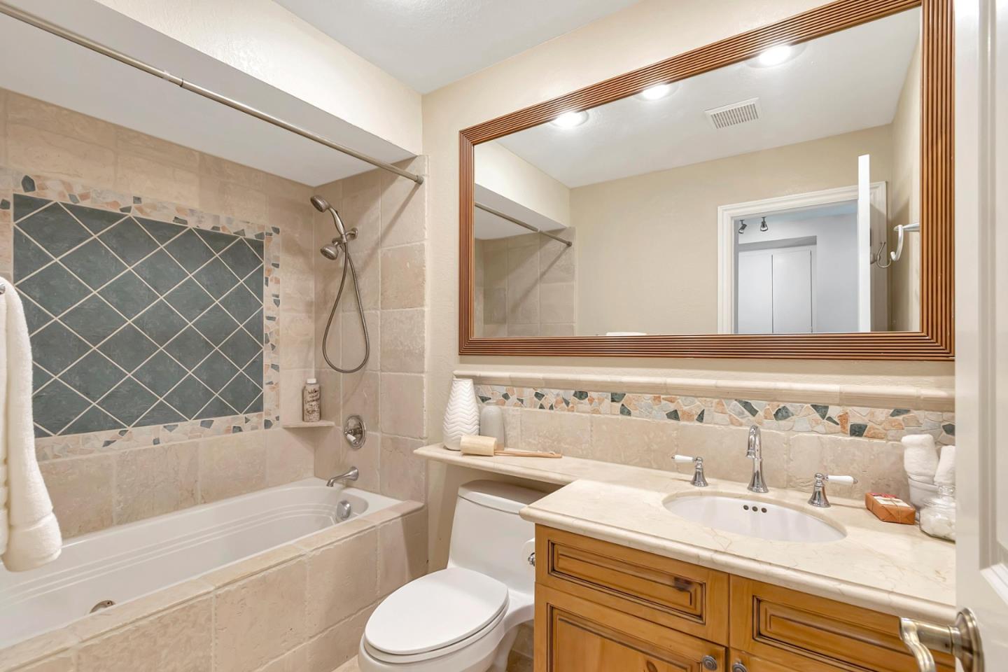 Utopia Place San Jose, CA 95127 - Photo 18 of 35 a bathroom with a sink vanity tub and toilet
