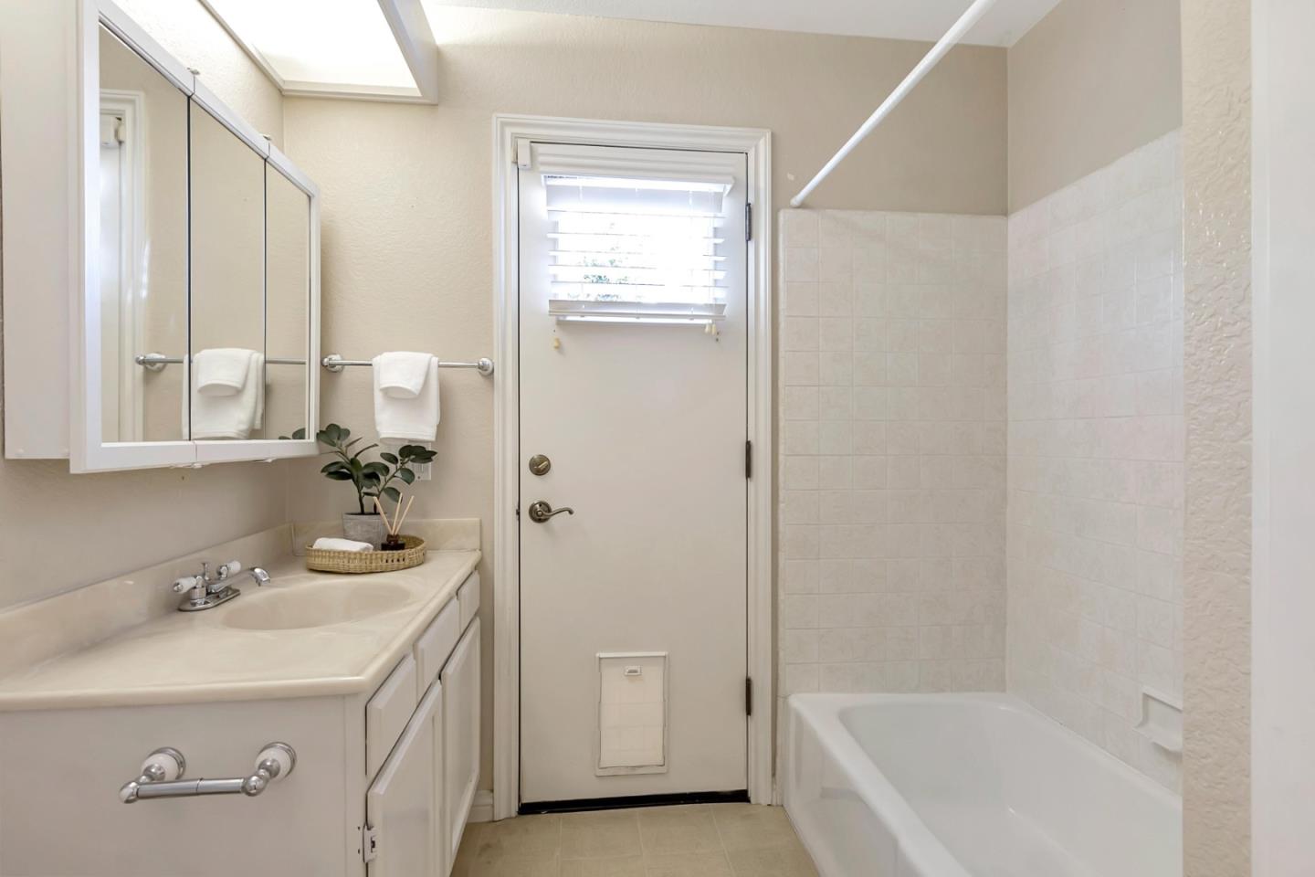 Utopia Place San Jose, CA 95127 - Photo 20 of 35 a bathroom with a sink a mirror and a bathtub