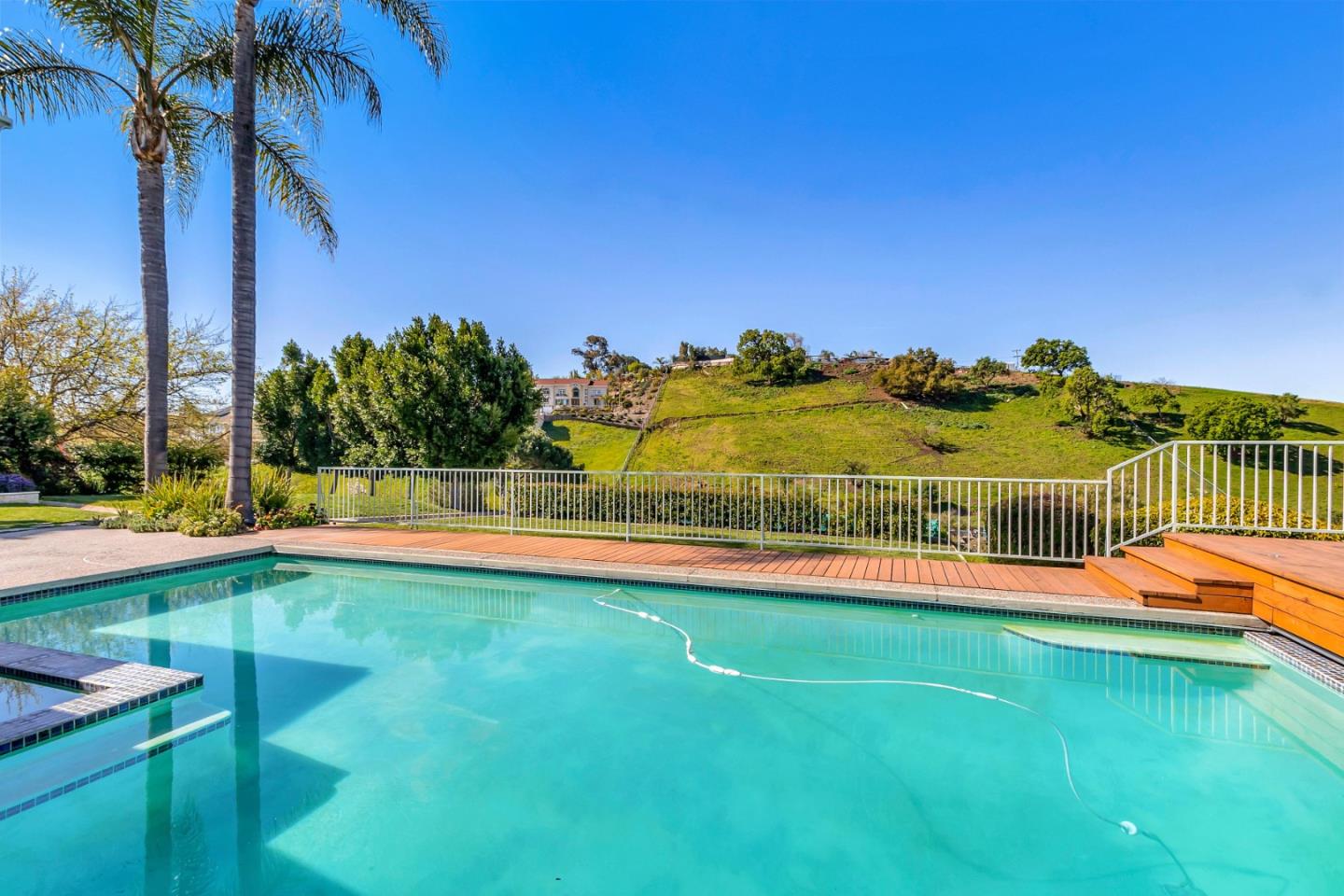 Utopia Place San Jose, CA 95127 - Photo 26 of 35 a view of a swimming pool with an outdoor seating and a yard