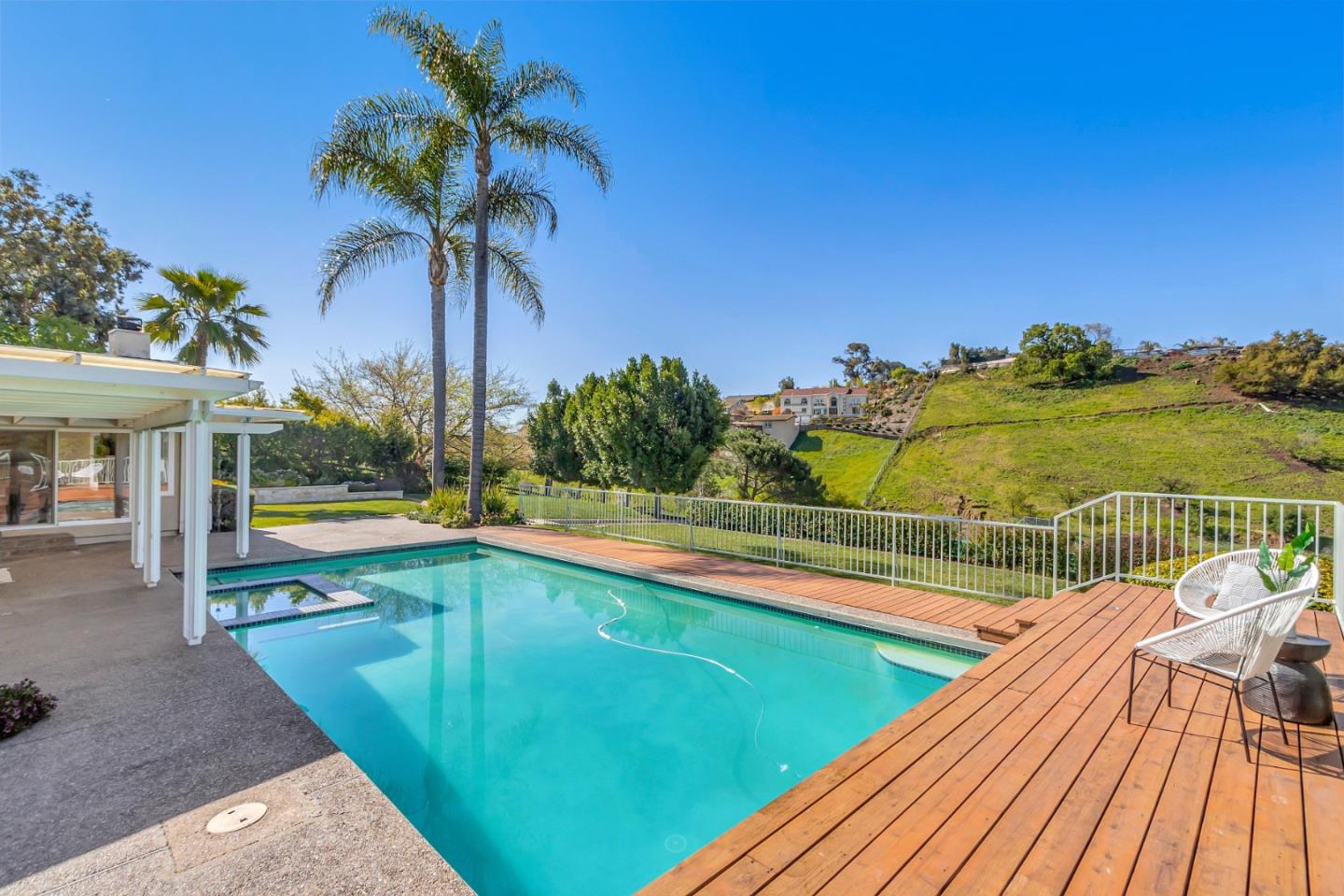 Utopia Place San Jose, CA 95127 - Photo 28 of 35 a view of a swimming pool with a patio and a yard