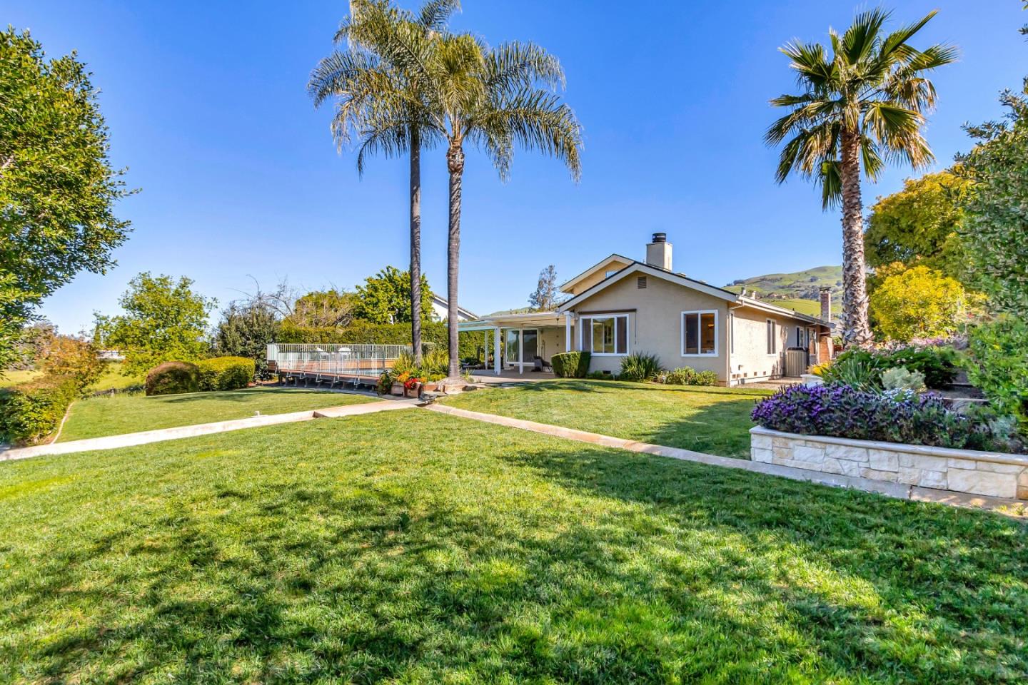 Utopia Place San Jose, CA 95127 - Photo 29 of 35 a front view of a house with a garden and yard