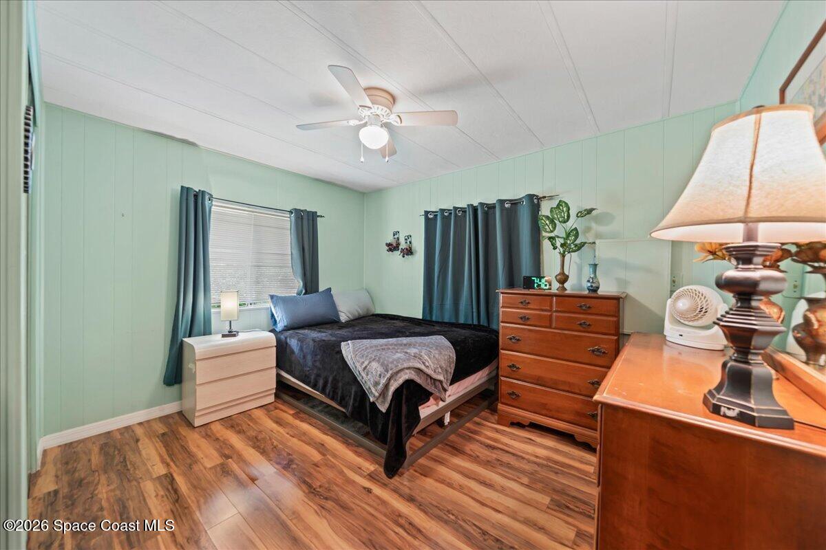 1740 Seagrape Street Northeast Palm Bay, FL 32905 - Photo 12 of 33 a bedroom with a bed and window