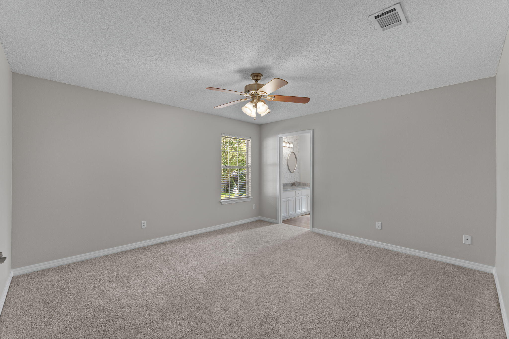 8134 Menorca Street Navarre, FL 32566 - Photo 18 of 54 a view of an empty room with a window