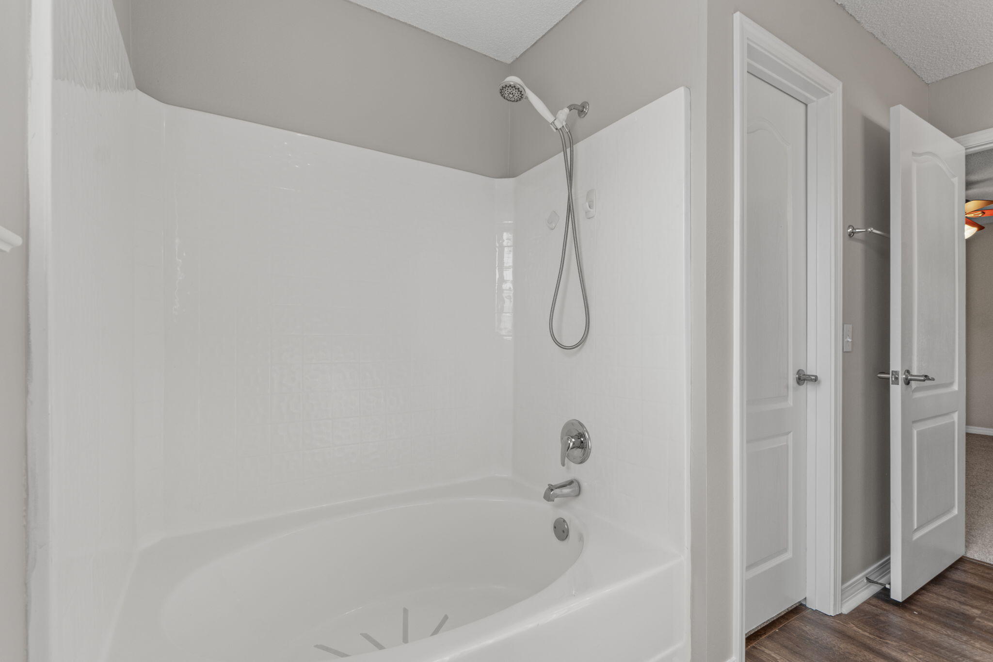 8134 Menorca Street Navarre, FL 32566 - Photo 21 of 54 a bathroom with a bathtub and a shower