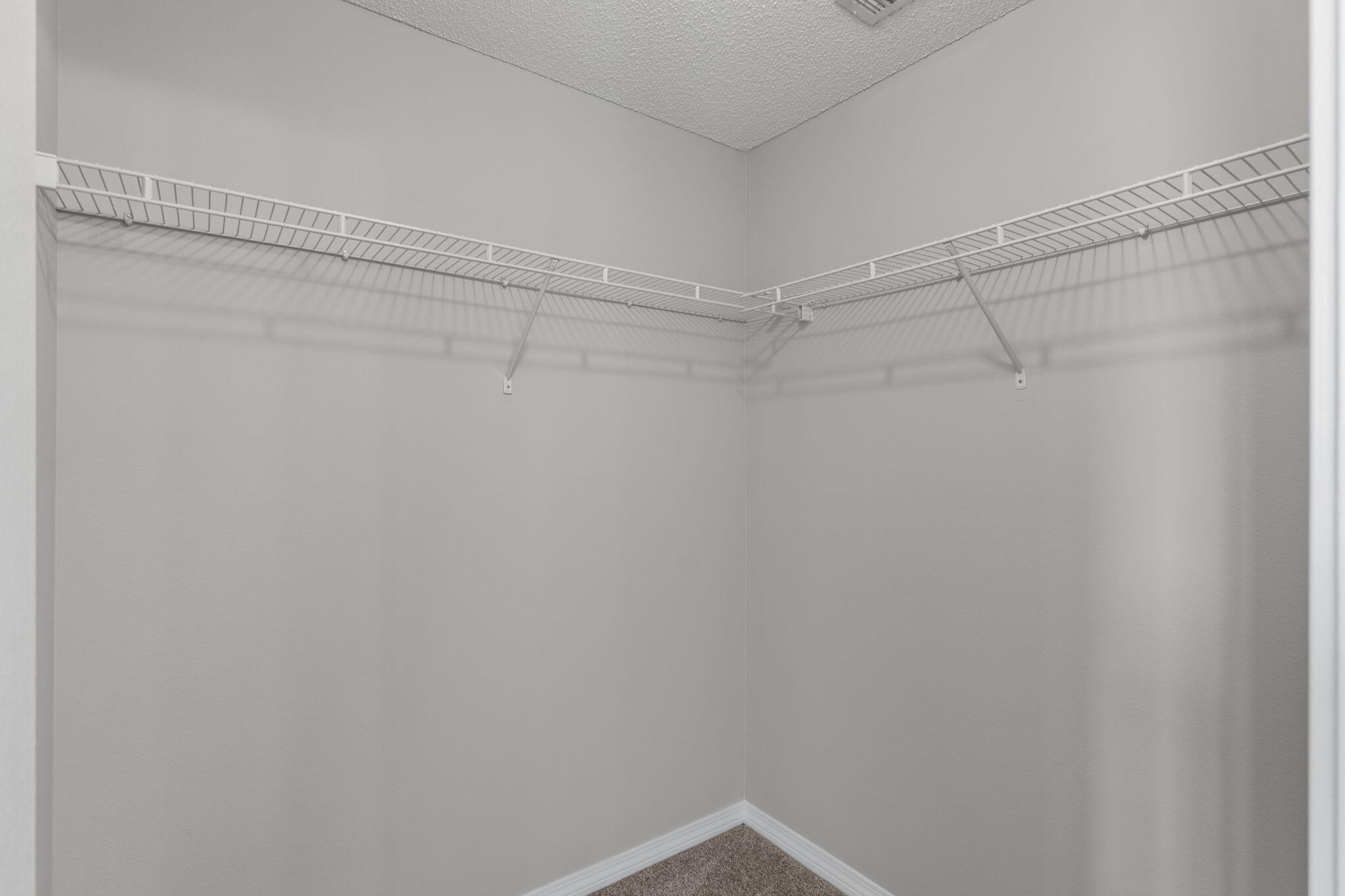8134 Menorca Street Navarre, FL 32566 - Photo 22 of 54 a view of a room with racks on the wall