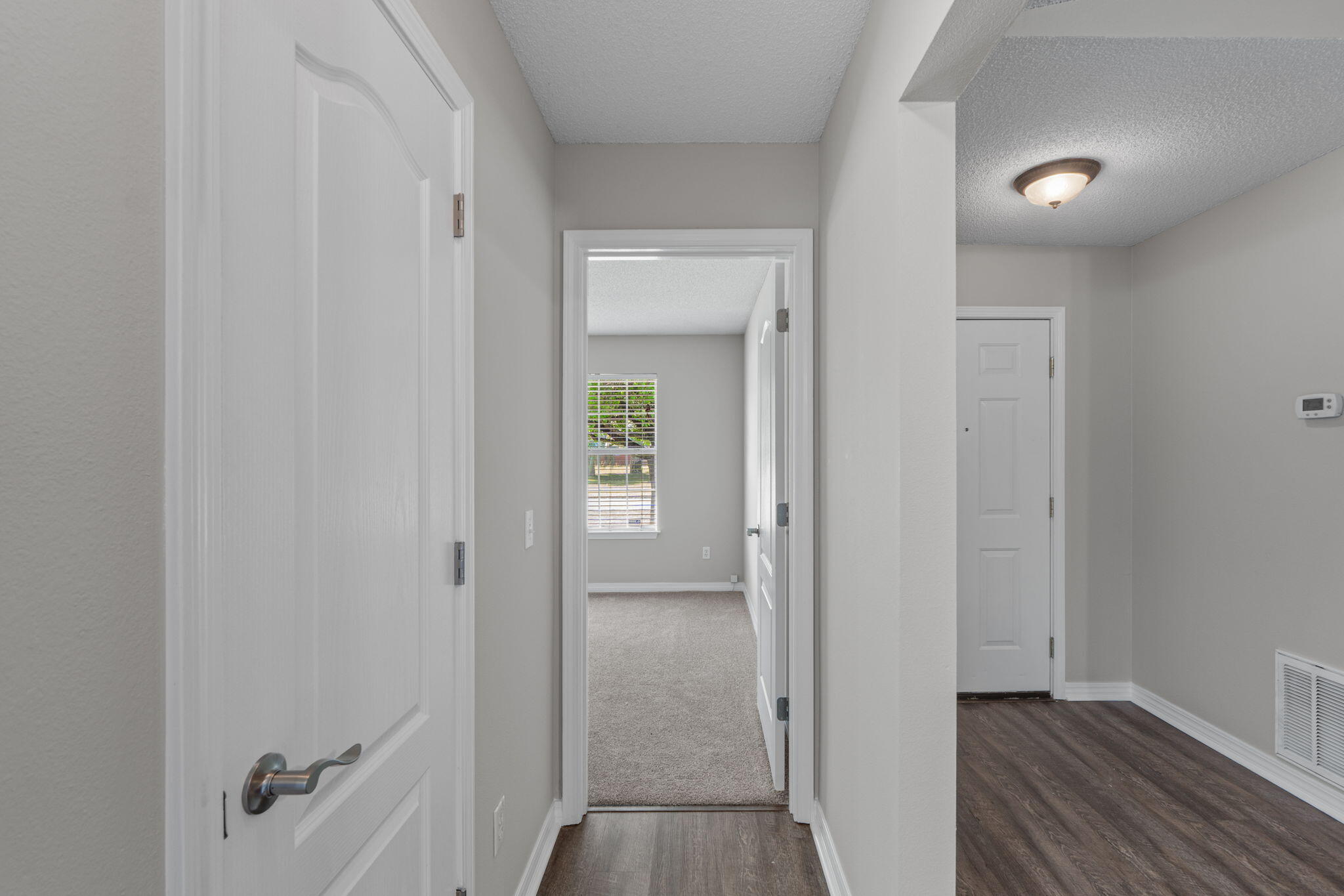 8134 Menorca Street Navarre, FL 32566 - Photo 23 of 54 a view of a bathroom from the hallway