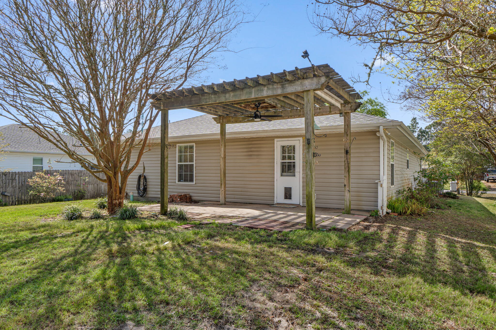8134 Menorca Street Navarre, FL 32566 - Photo 33 of 54 front view of a house with a yard