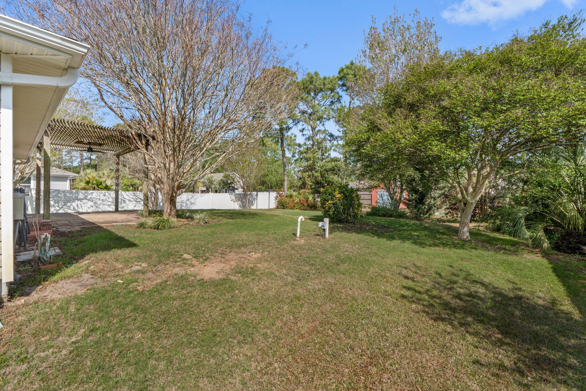 8134 Menorca Street Navarre, FL 32566 - Photo 35 of 54 a view of yard with tree