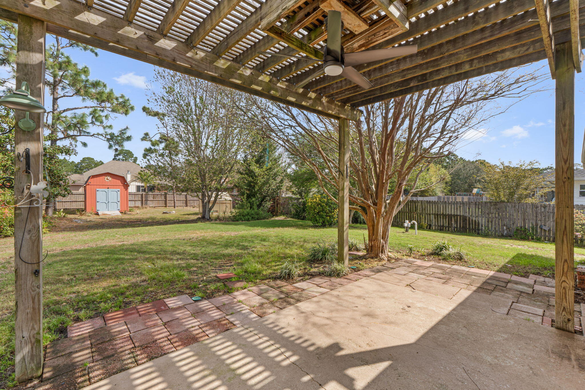 8134 Menorca Street Navarre, FL 32566 - Photo 36 of 54 a view of swimming pool with a backyard and trees
