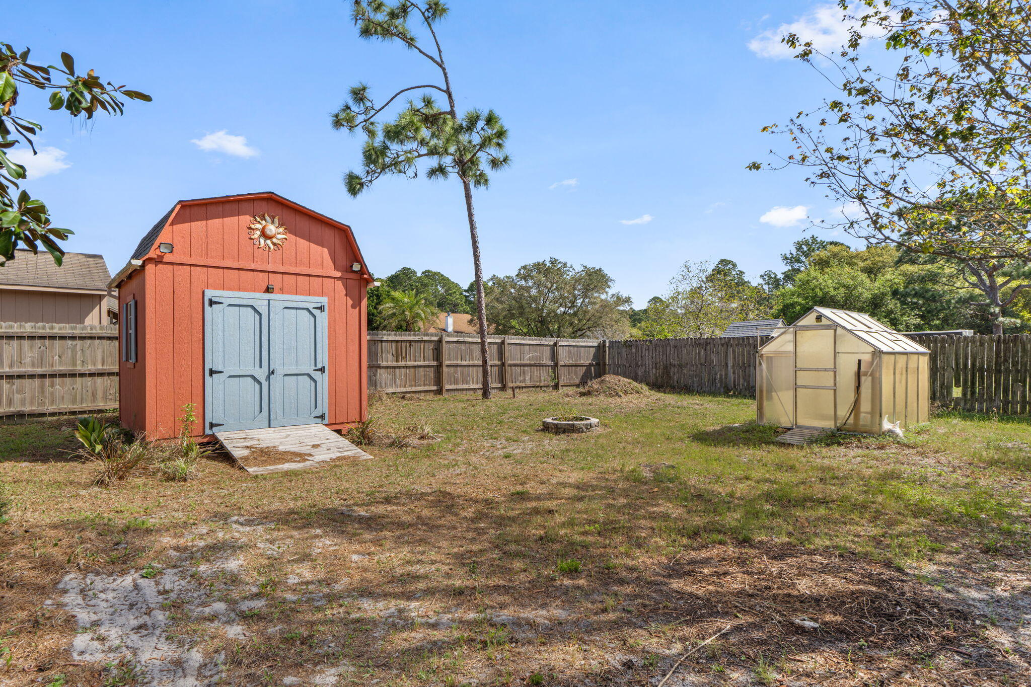 8134 Menorca Street Navarre, FL 32566 - Photo 38 of 54 a view of a backyard