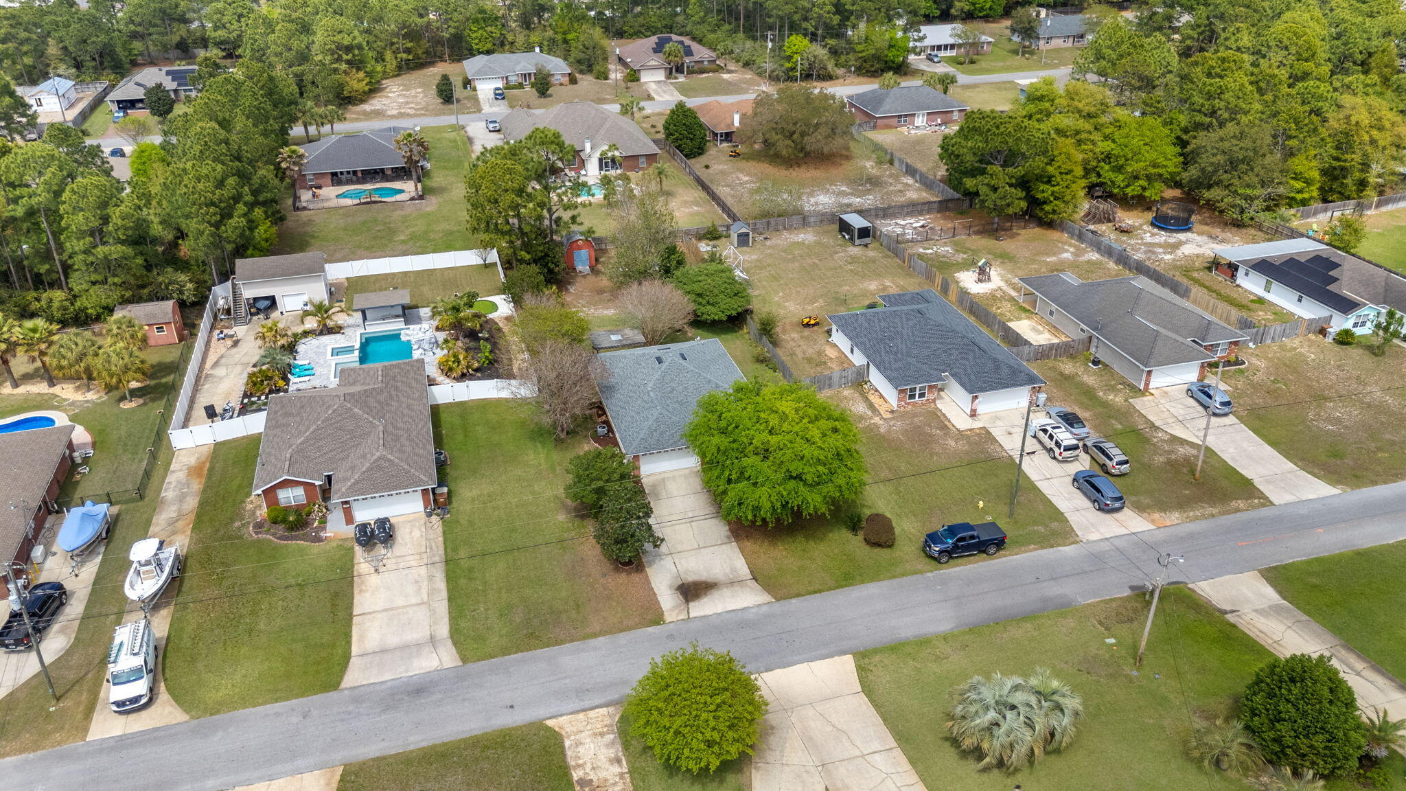 8134 Menorca Street Navarre, FL 32566 - Photo 41 of 54 an aerial view of residential houses with outdoor space