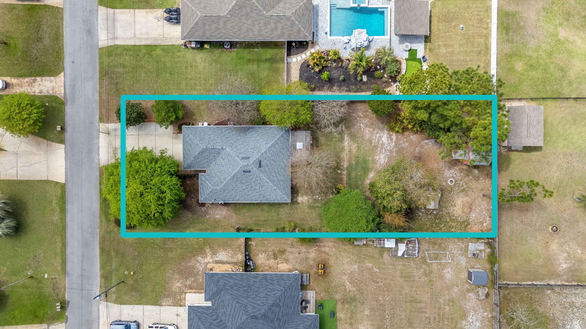 8134 Menorca Street Navarre, FL 32566 - Photo 42 of 54 an aerial view of a house with a garden and a yard