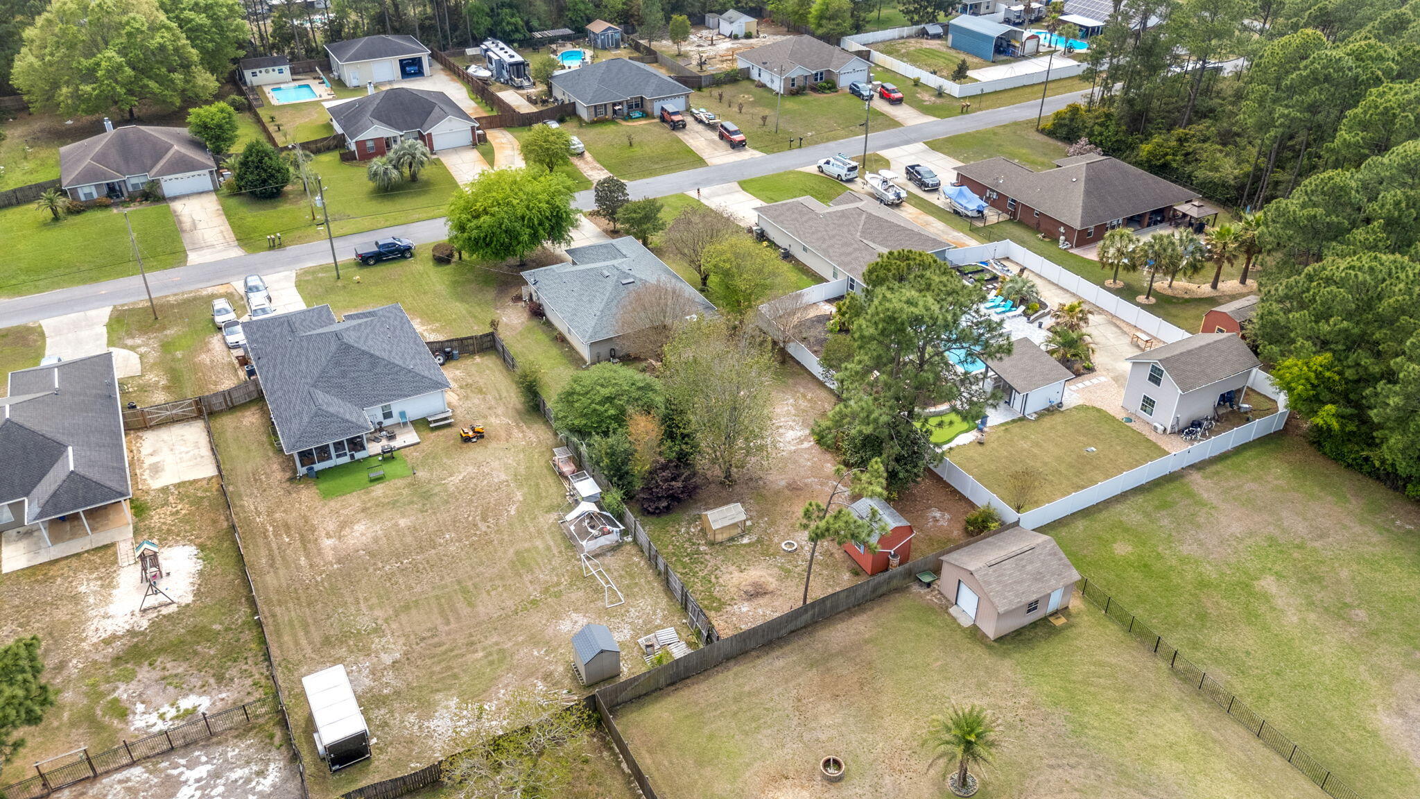 8134 Menorca Street Navarre, FL 32566 - Photo 43 of 54 an aerial view of residential houses with outdoor space