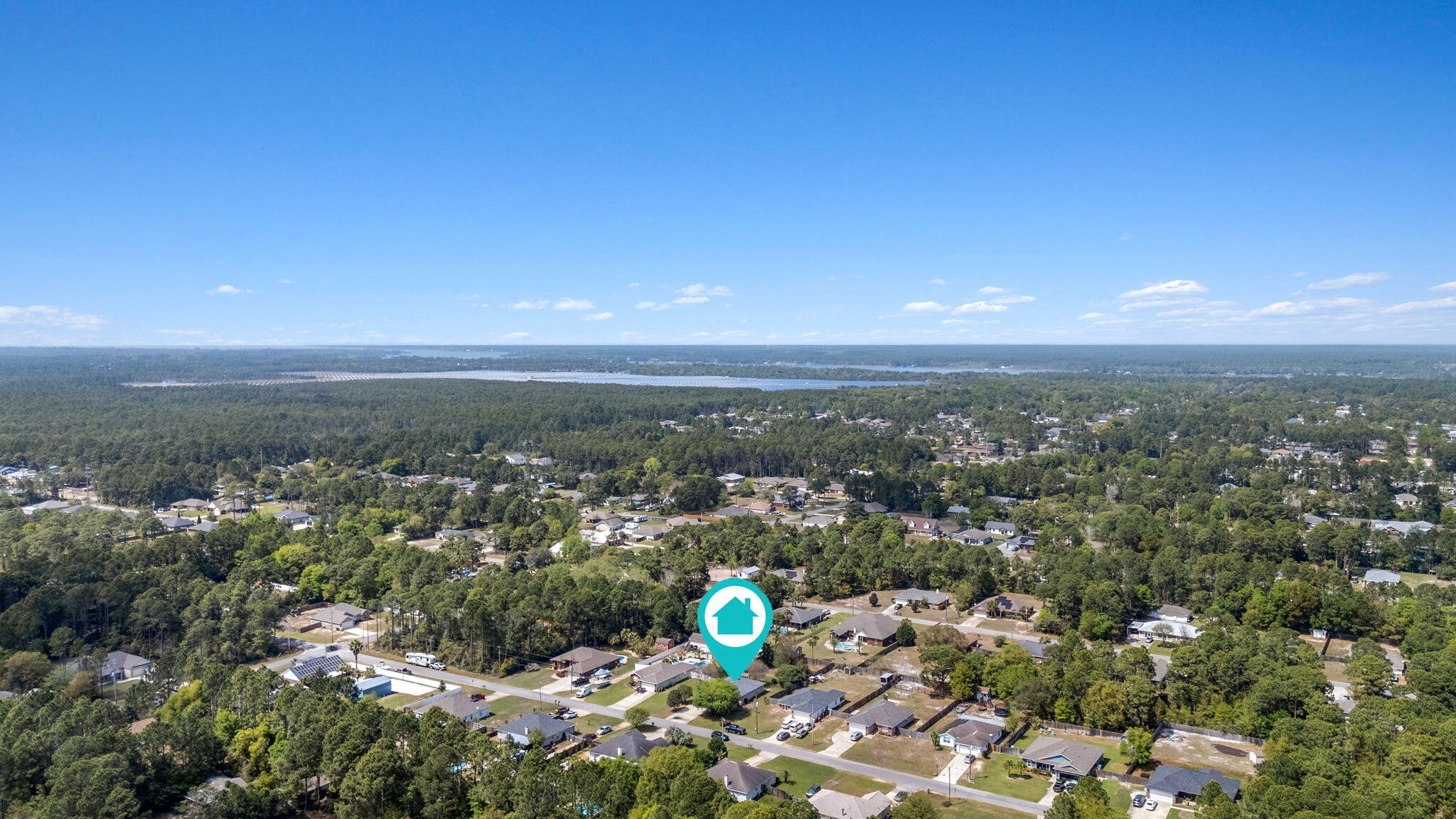 8134 Menorca Street Navarre, FL 32566 - Photo 46 of 54 an aerial view of a city