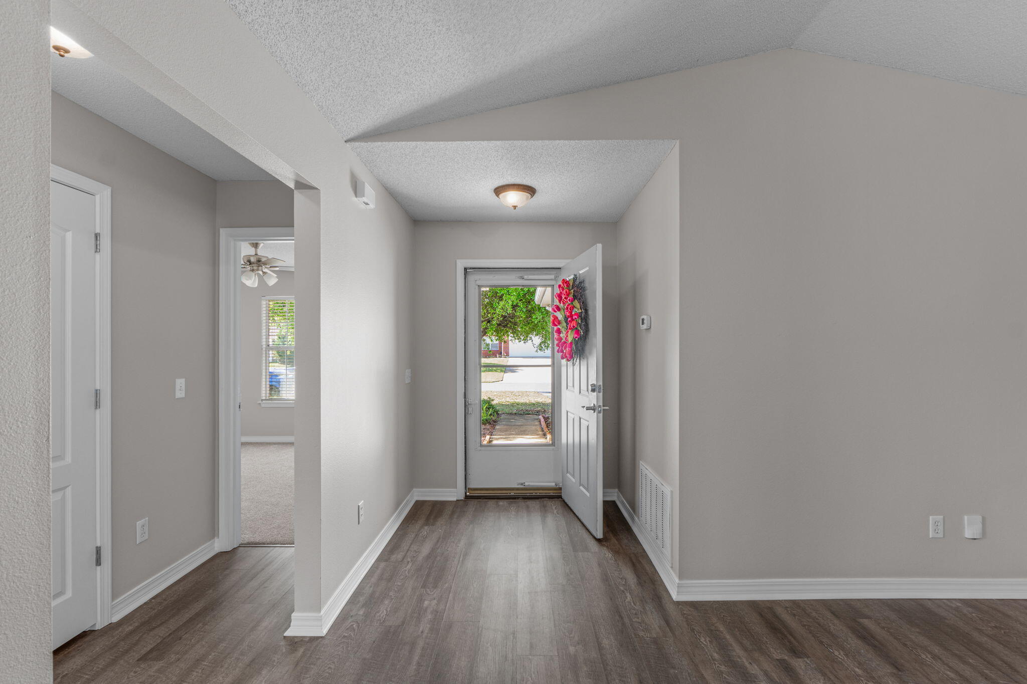 8134 Menorca Street Navarre, FL 32566 - Photo 6 of 54 a view of entryway with wooden floor