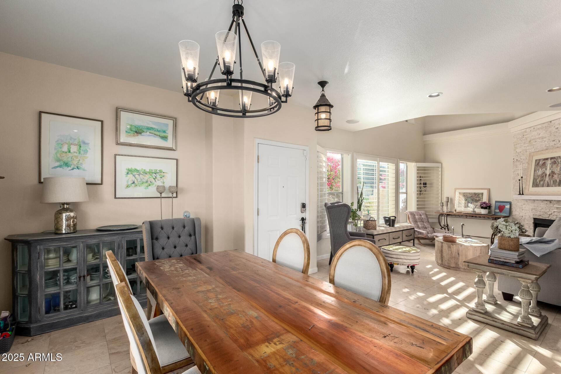 8818 South 51st Street, Unit 1 Phoenix, AZ 85044 - Photo 6 of 26 a bedroom with furniture and a chandelier