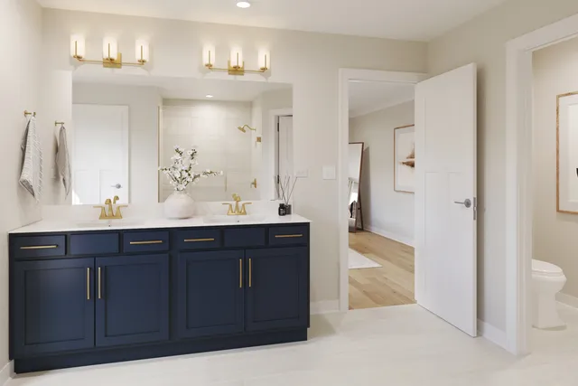 a bathroom with a sink vanity granite and a mirror