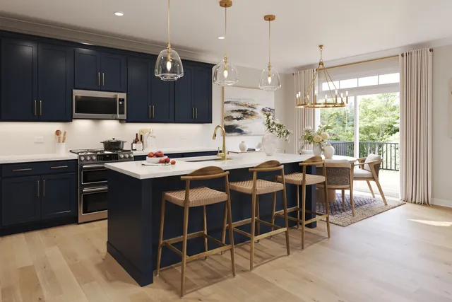 a kitchen with a dining table chairs sink and white appliances