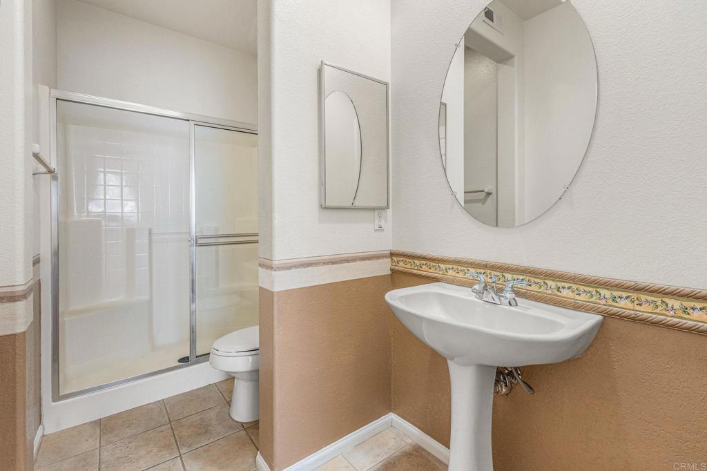 564 Echo Lane San Marcos, CA 92078 - Photo 15 of 27 a bathroom with a sink toilet and shower