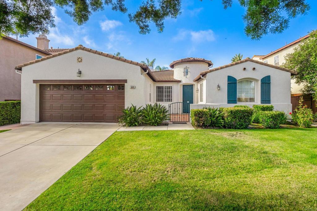 564 Echo Lane San Marcos, CA 92078 - Photo 3 of 27 a front view of a house with garden