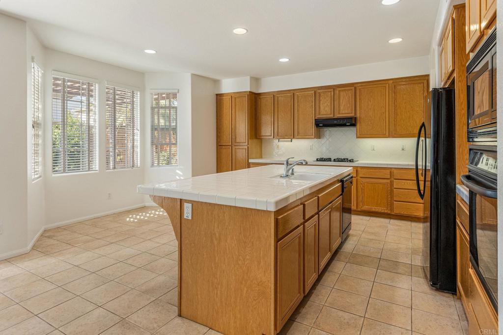 564 Echo Lane San Marcos, CA 92078 - Photo 10 of 27 a kitchen with a sink stove and cabinets