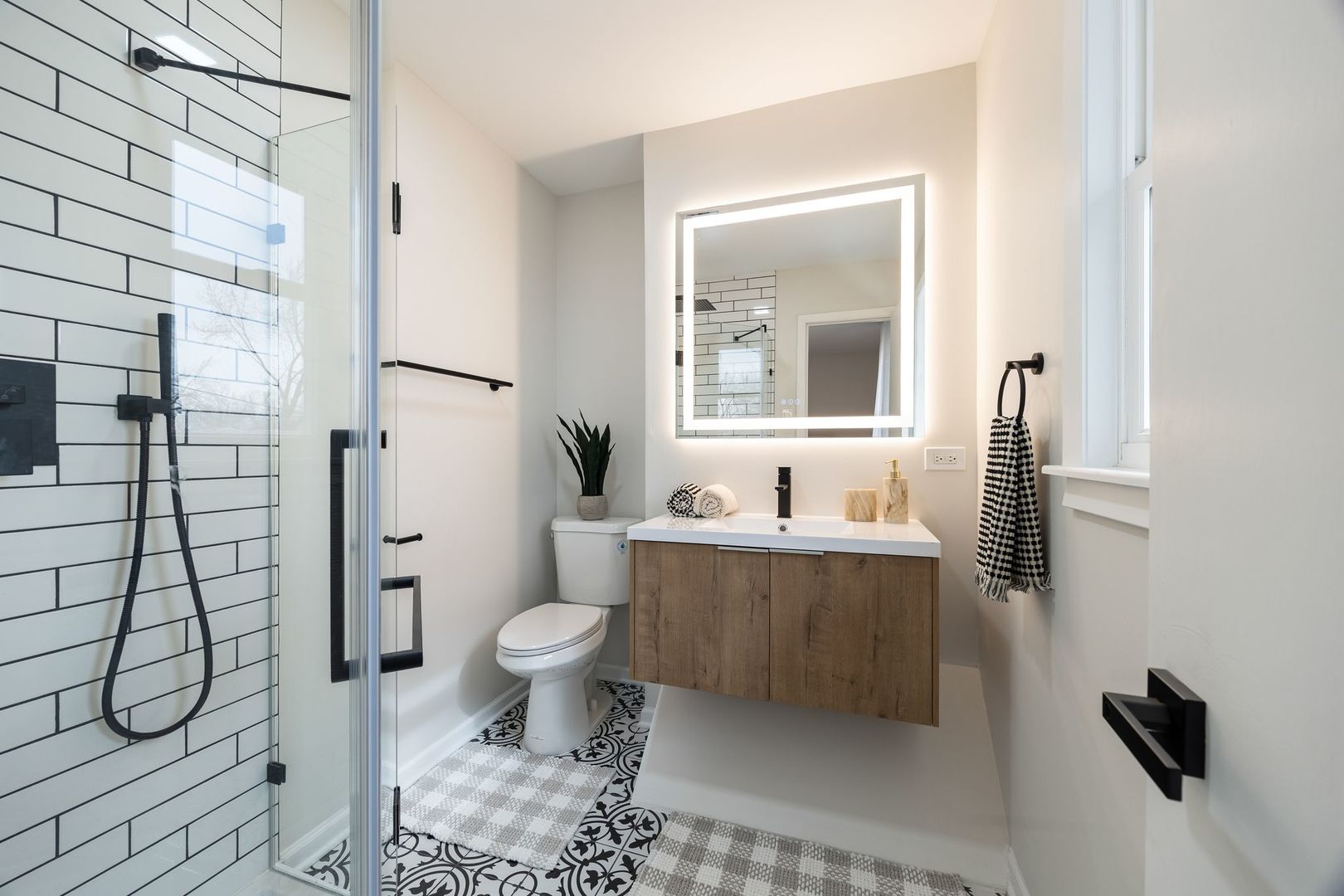 6791 Church Street Hanover Park, IL 60133 - Photo 11 of 24 a bathroom with a sink toilet and shower