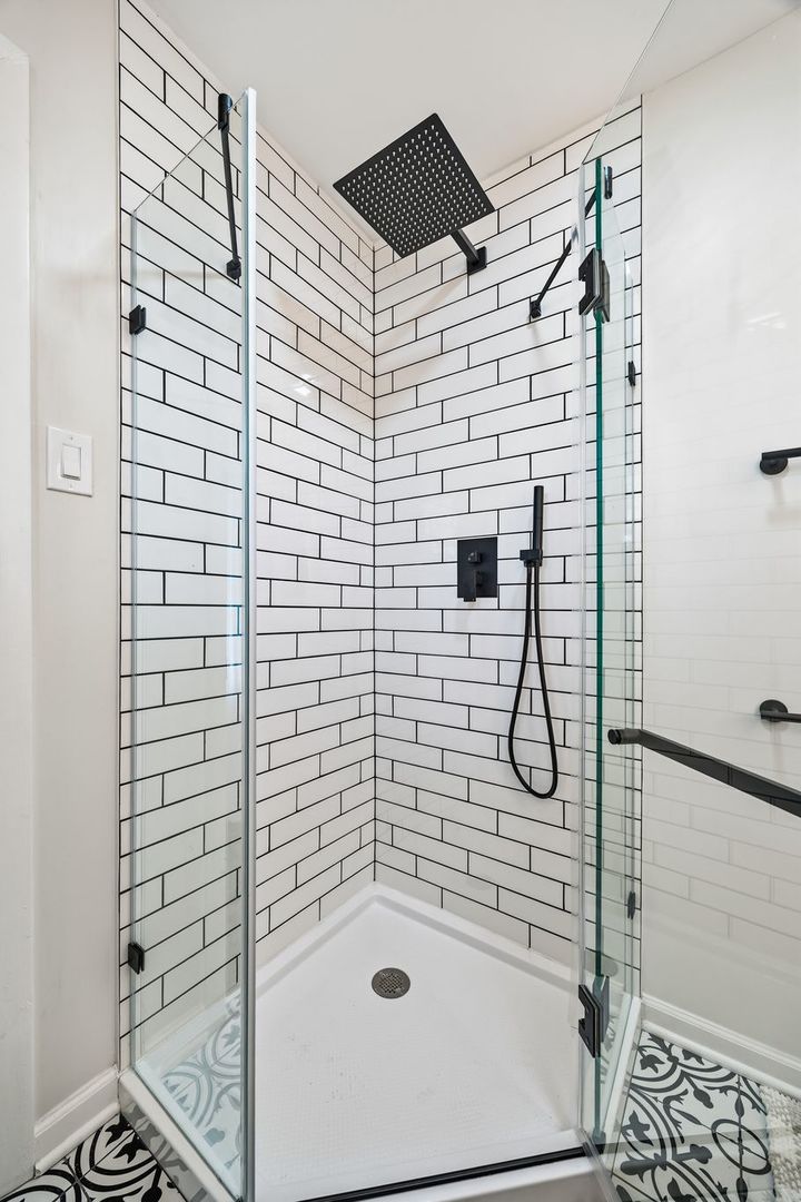 6791 Church Street Hanover Park, IL 60133 - Photo 12 of 24 a bathroom with a sink and a shower