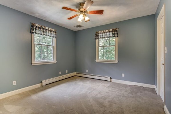 12 Ogunquit Road Wilmington, MA 01887 - Photo 19 of 27 a view of an empty room with a window