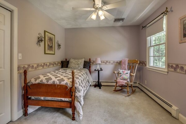 12 Ogunquit Road Wilmington, MA 01887 - Photo 20 of 27 a bedroom with a bed and a window