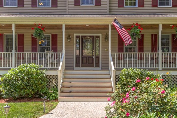 12 Ogunquit Road Wilmington, MA 01887 - Photo 2 of 27 a view of a house with a flower garden