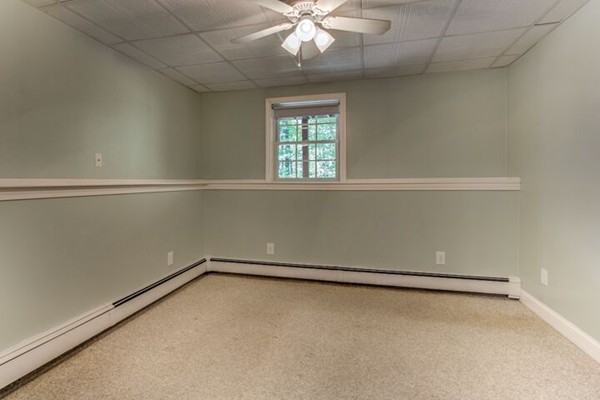 12 Ogunquit Road Wilmington, MA 01887 - Photo 24 of 27 an empty room with a window