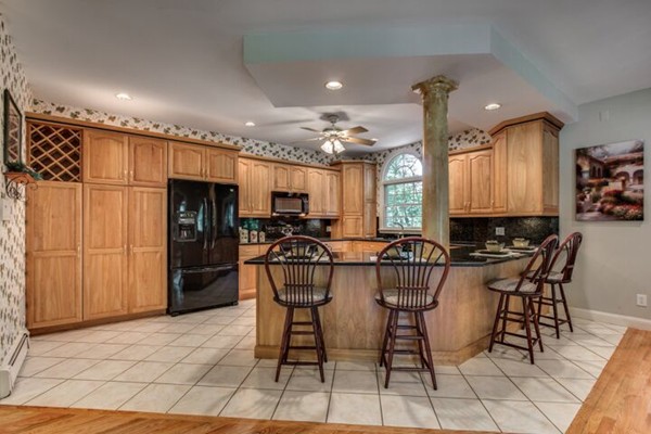 12 Ogunquit Road Wilmington, MA 01887 - Photo 6 of 27 a view of a dining room with furniture