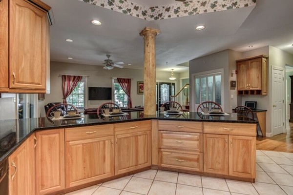 12 Ogunquit Road Wilmington, MA 01887 - Photo 8 of 27 a kitchen with sink cabinets and window