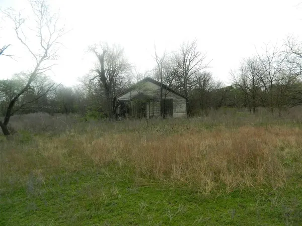 a view of a backyard with furniture