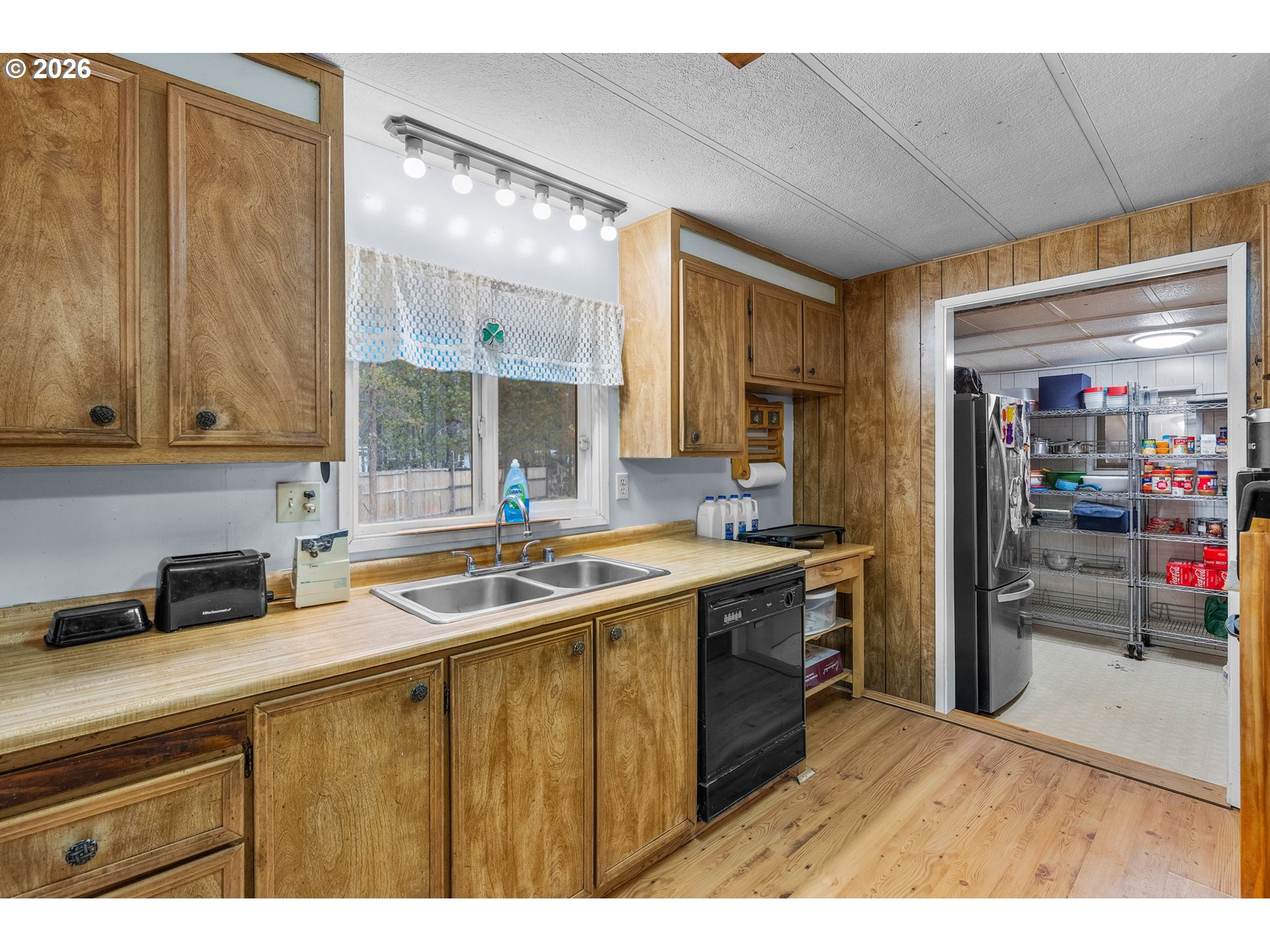 17114 Faun Lane La Pine, OR 97739 - Photo 11 of 28 a kitchen with a sink and cabinets