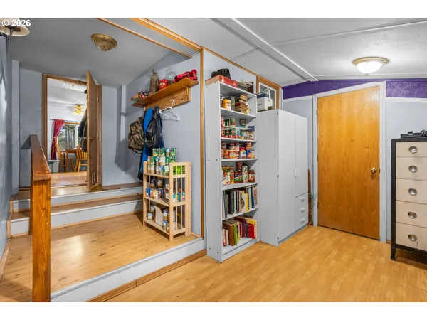 a view of an entryway with wooden floor