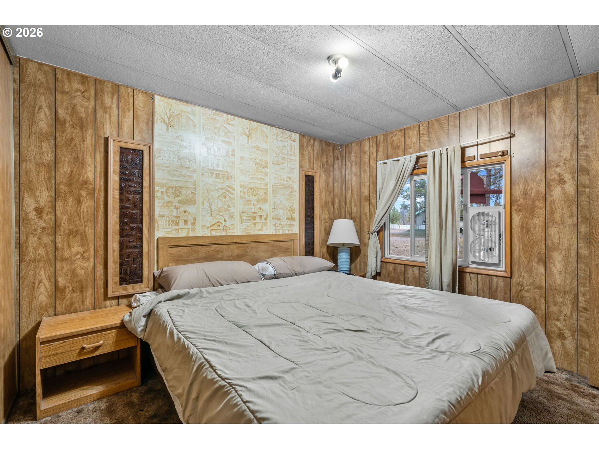 17114 Faun Lane La Pine, OR 97739 - Photo 17 of 28 a bedroom with a large bed and a window