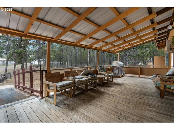 a view of a patio with wooden floor