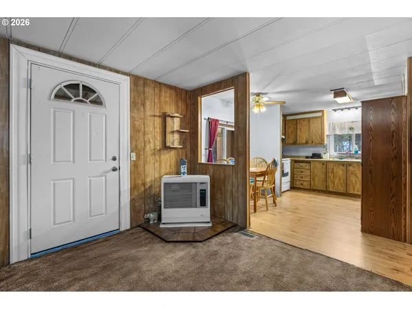 a living room with stainless steel appliances kitchen island granite countertop furniture and a kitchen view