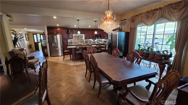 a view of a dining room with furniture window and outside view